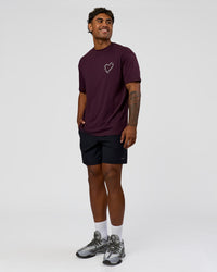 Man wearing Love The Process FLXCotton Oversize Tee - Midnight Plum-White | Model:Xav | Size:L