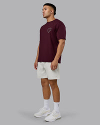 Man wearing Love The Process FLXCotton Oversize Tee - Cherry Lacquer-Shale Beige | Model:Kaelyb | Size:L