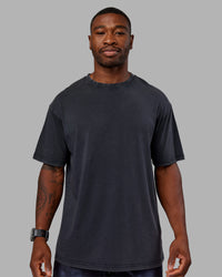 Man wearing Love The Run FLXCotton Tee Oversize - Black Washed-Circular Grey | Model:Sam | Size:L