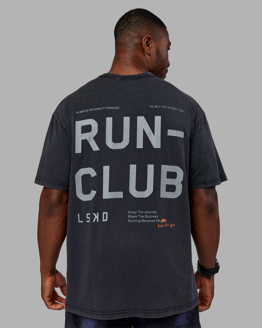 Man wearing Love The Run FLXCotton Tee Oversize - Black Washed-Circular Grey | Model:Sam | Size:L