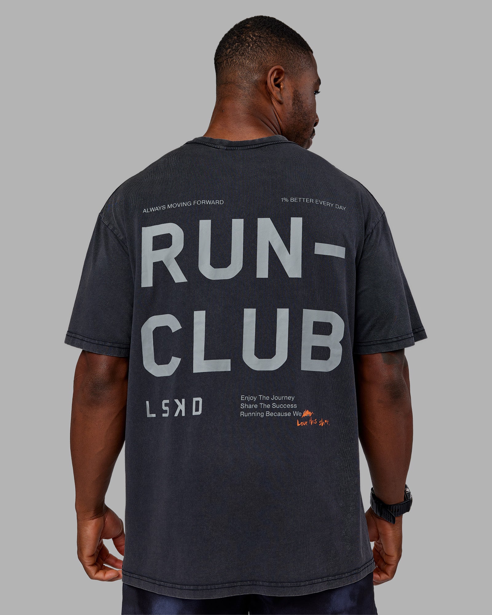 Man wearing Love The Run FLXCotton Tee Oversize - Black Washed-Circular Grey | Model:Sam | Size:L
