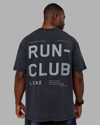 Man wearing Love The Run FLXCotton Tee Oversize - Black Washed-Circular Grey | Model:Sam | Size:L