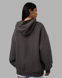 Woman wearing MVP Oversized Hoodie - Dark Storm | Model:Rhiley | Size:L