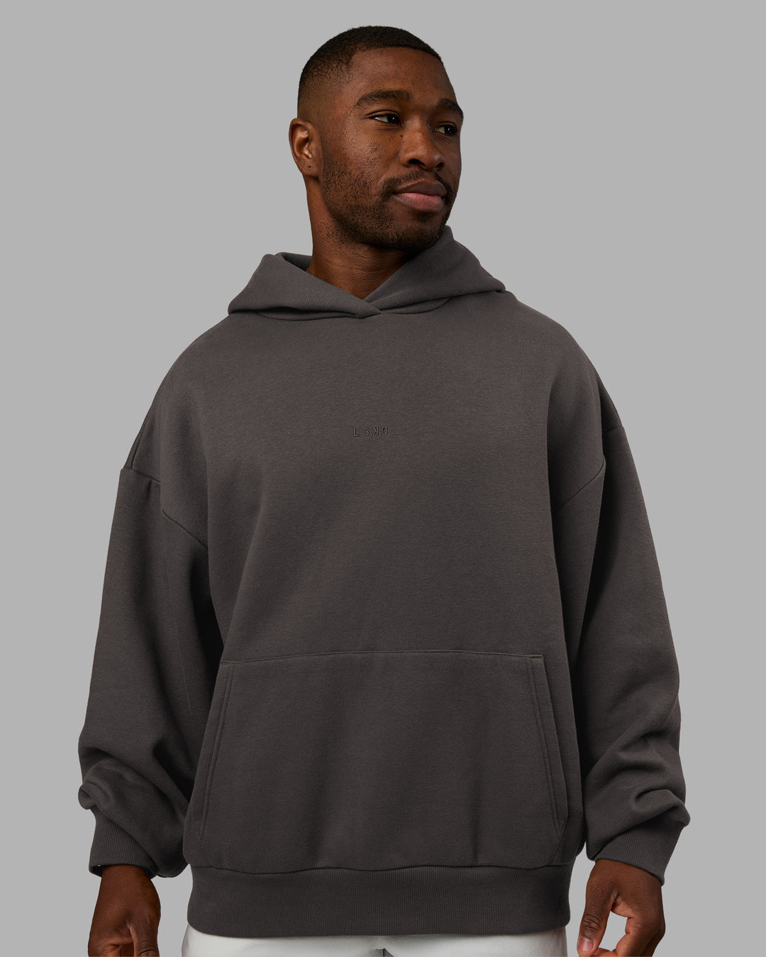 Man wearing MVP Oversized Hoodie - Dark Storm | Model:Sam | Size:L