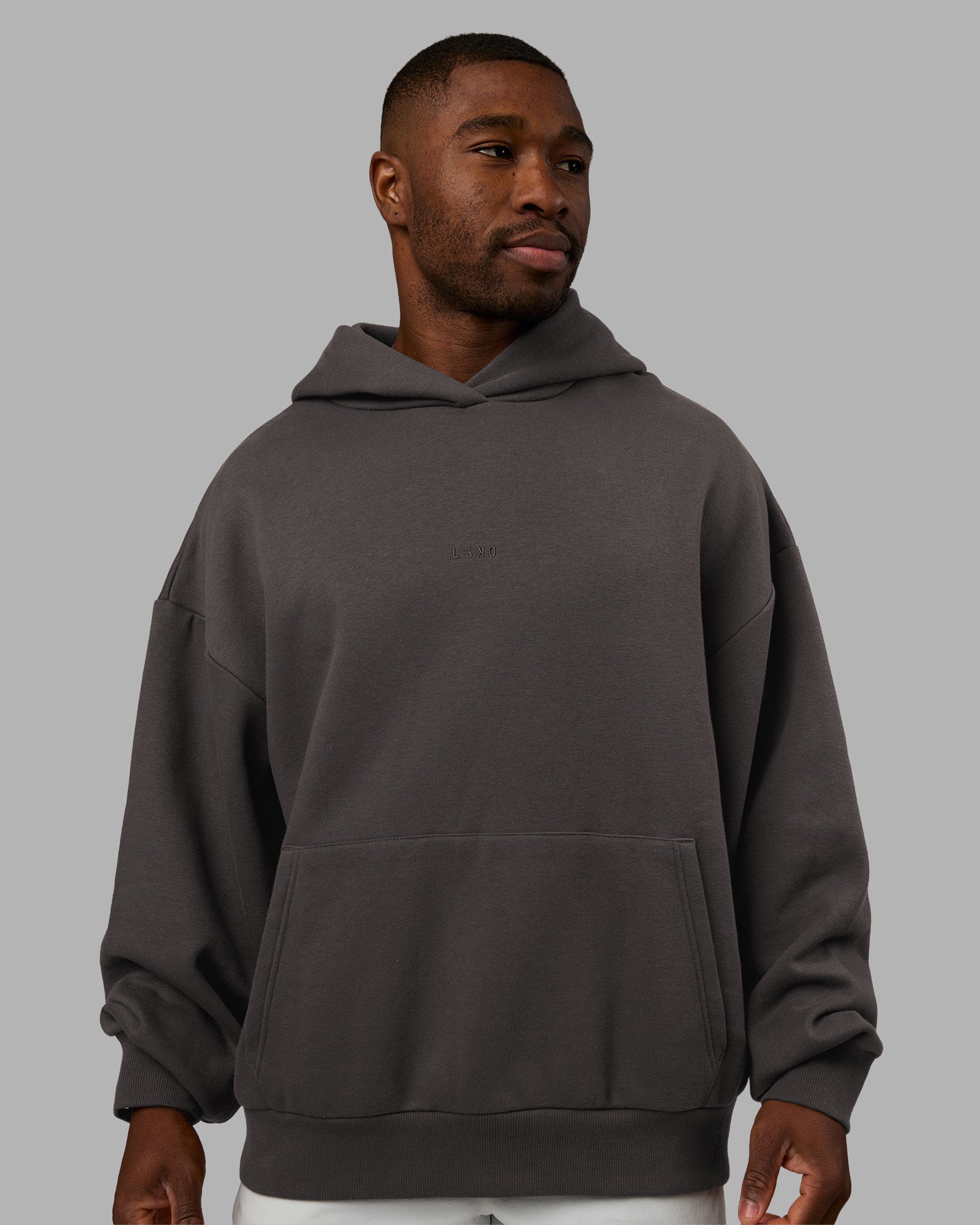 Man wearing MVP Oversized Hoodie - Dark Storm | Model:Sam | Size:L
