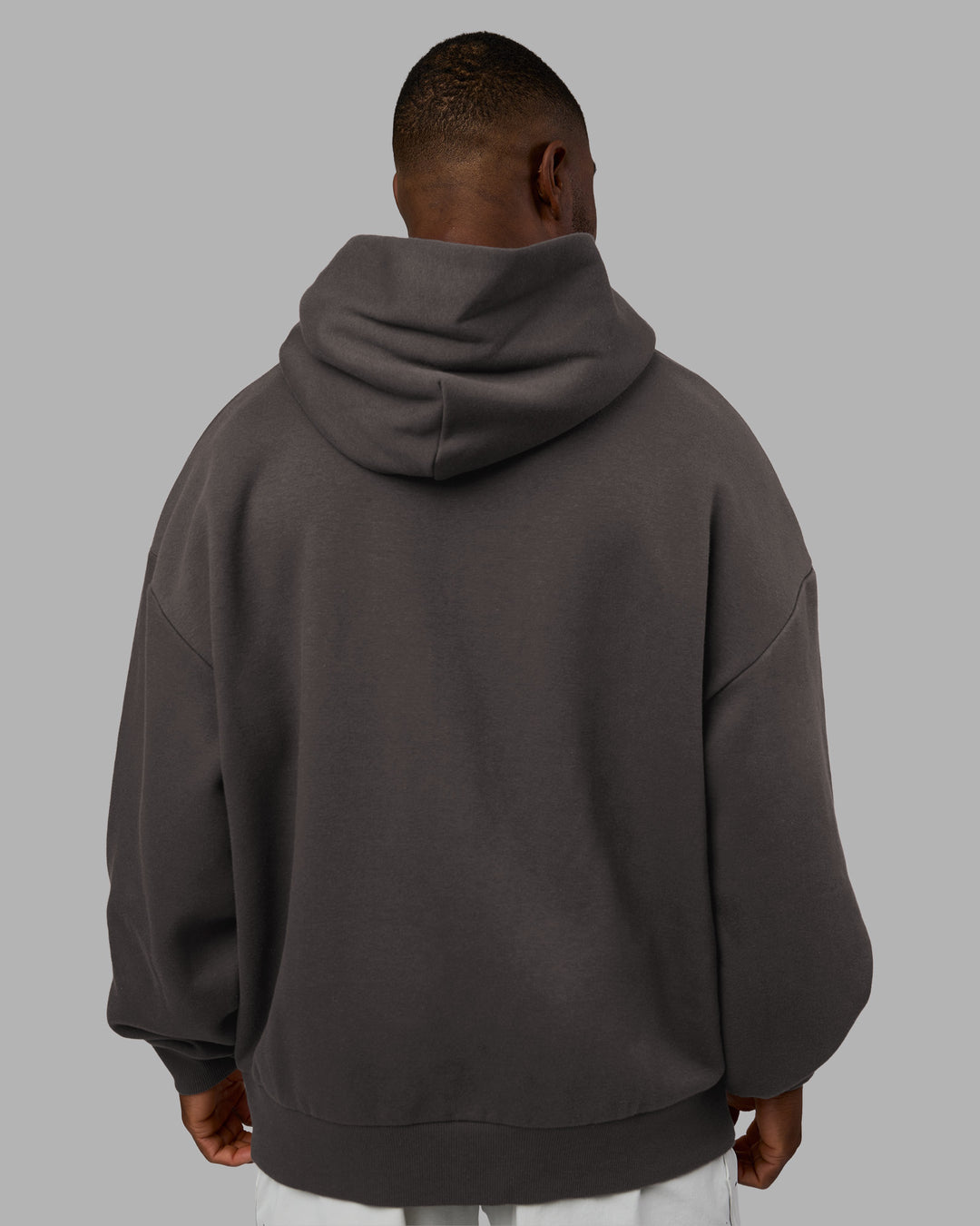 Man wearing MVP Oversized Hoodie - Dark Storm | Model:Sam | Size:L