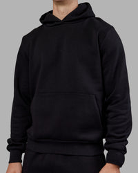 Man wearing MVP Regular Fit Hoodie - Black | Model:Tom | Size:L