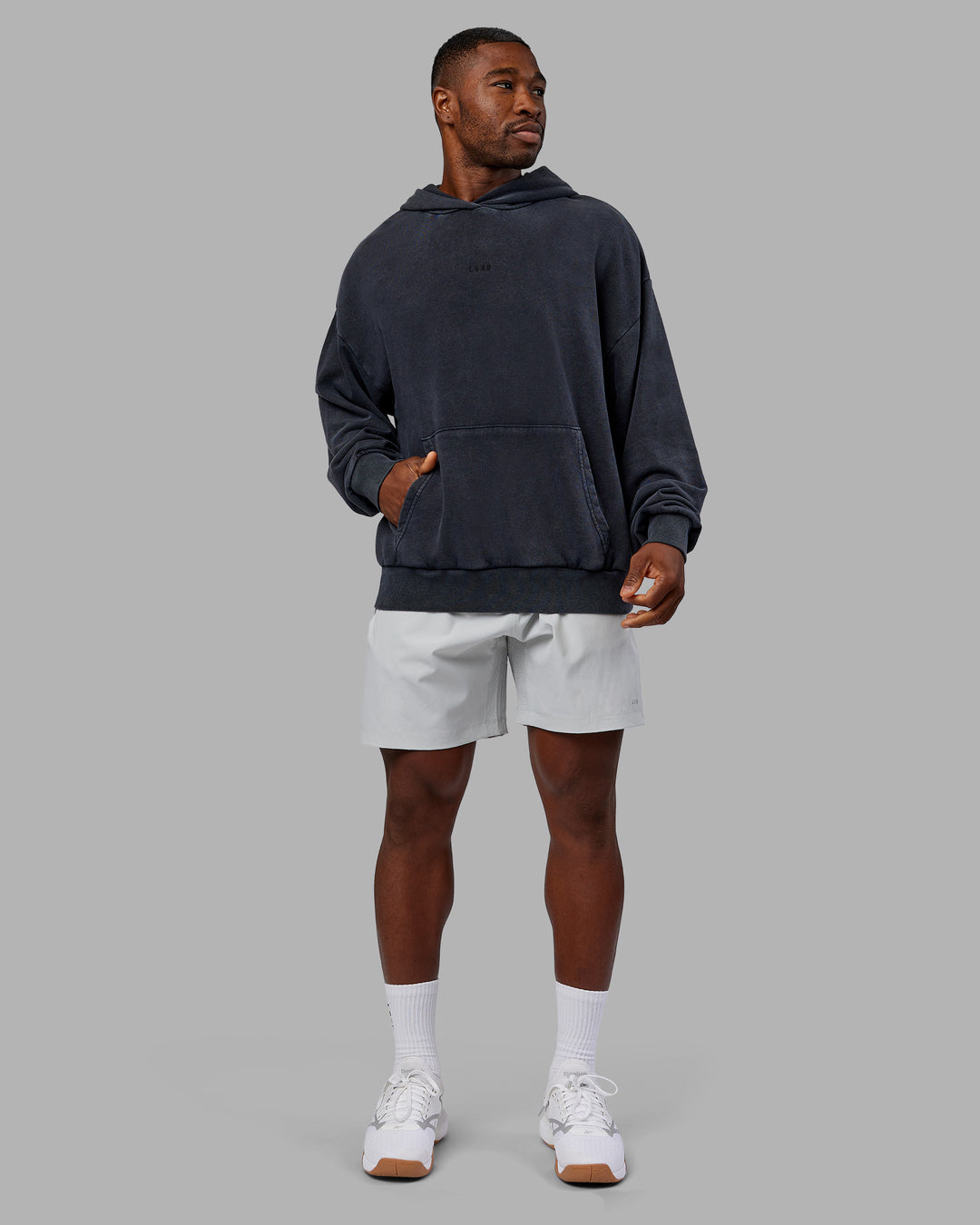 Man wearing MVP Washed Terry Oversized Hoodie - Black Washed | Model:Sam | Size:L