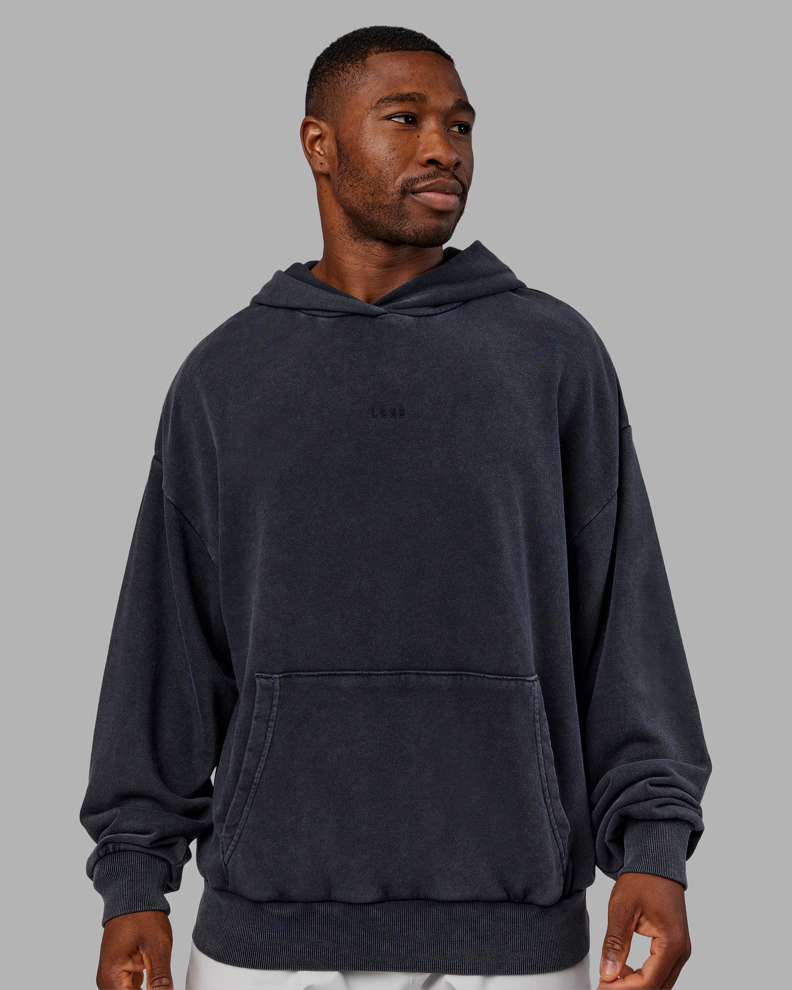 Man wearing MVP Washed Terry Oversized Hoodie - Black Washed | Model:Sam | Size:L