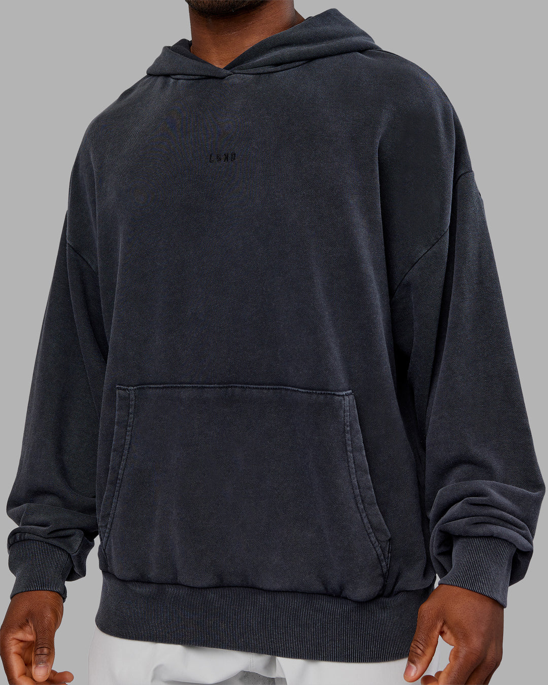 Man wearing MVP Washed Terry Oversized Hoodie - Black Washed | Model:Sam | Size:L