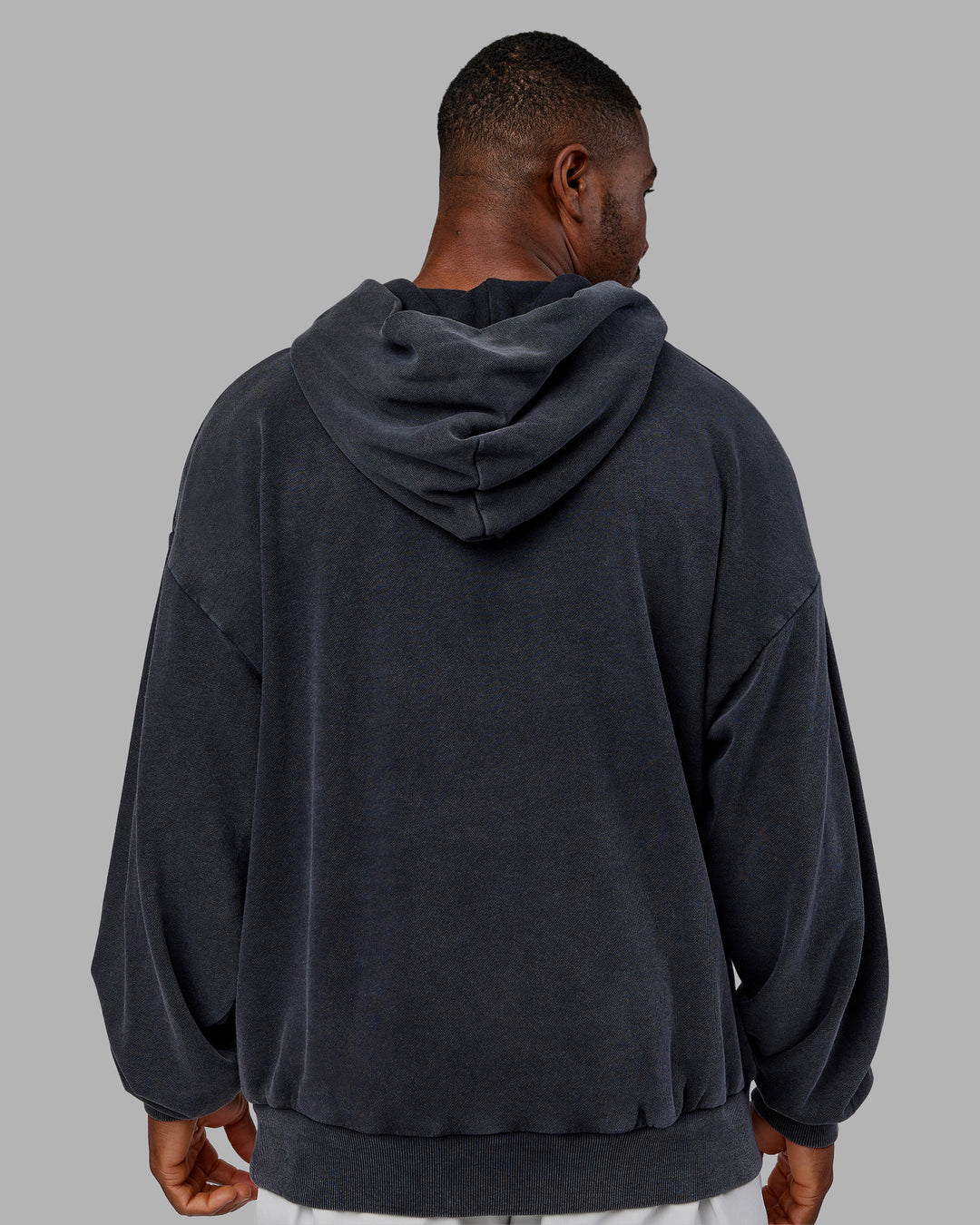 Man wearing MVP Washed Terry Oversized Hoodie - Black Washed | Model:Sam | Size:L