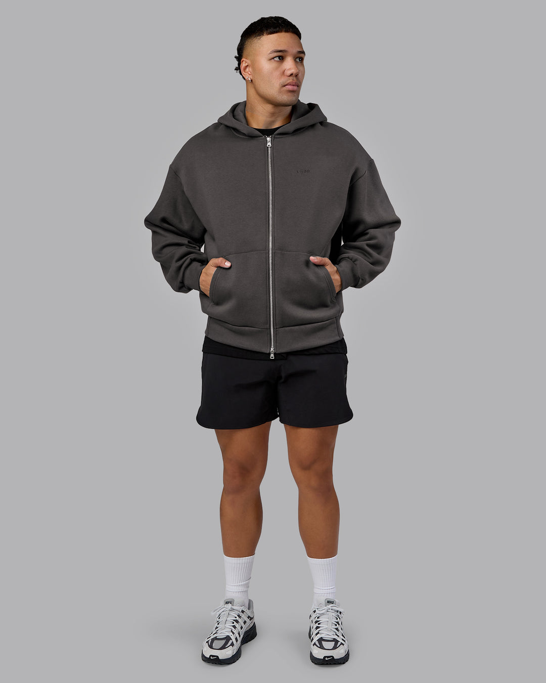 Man wearing MVP Zip Through Oversized Hoodie - Dark Storm | Model:Kaelyb | Size:L