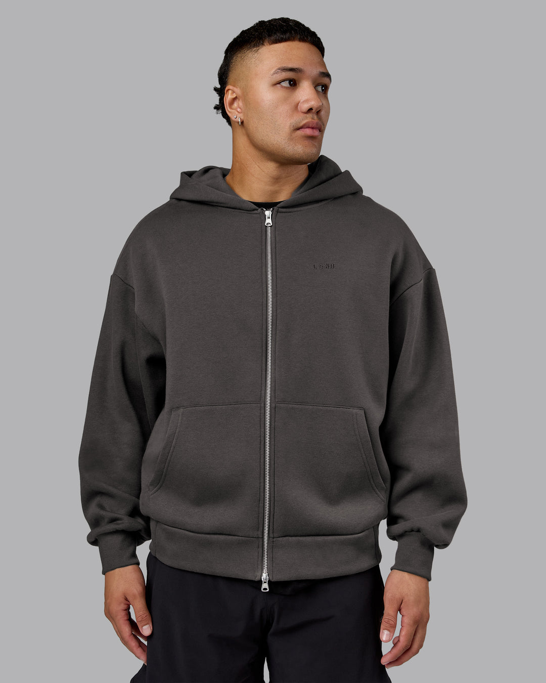 Man wearing MVP Zip Through Oversized Hoodie - Dark Storm | Model:Kaelyb | Size:L