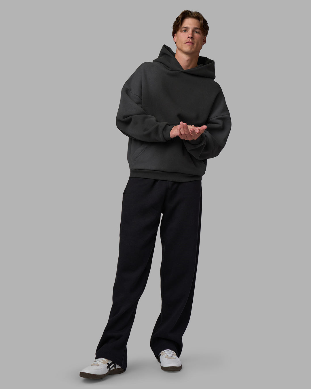 Man wearing Memory In Motion 500gsm Ultra Heavyweight Washed Hoodie - Charcoal Washed | Model:Brandon | Size:L