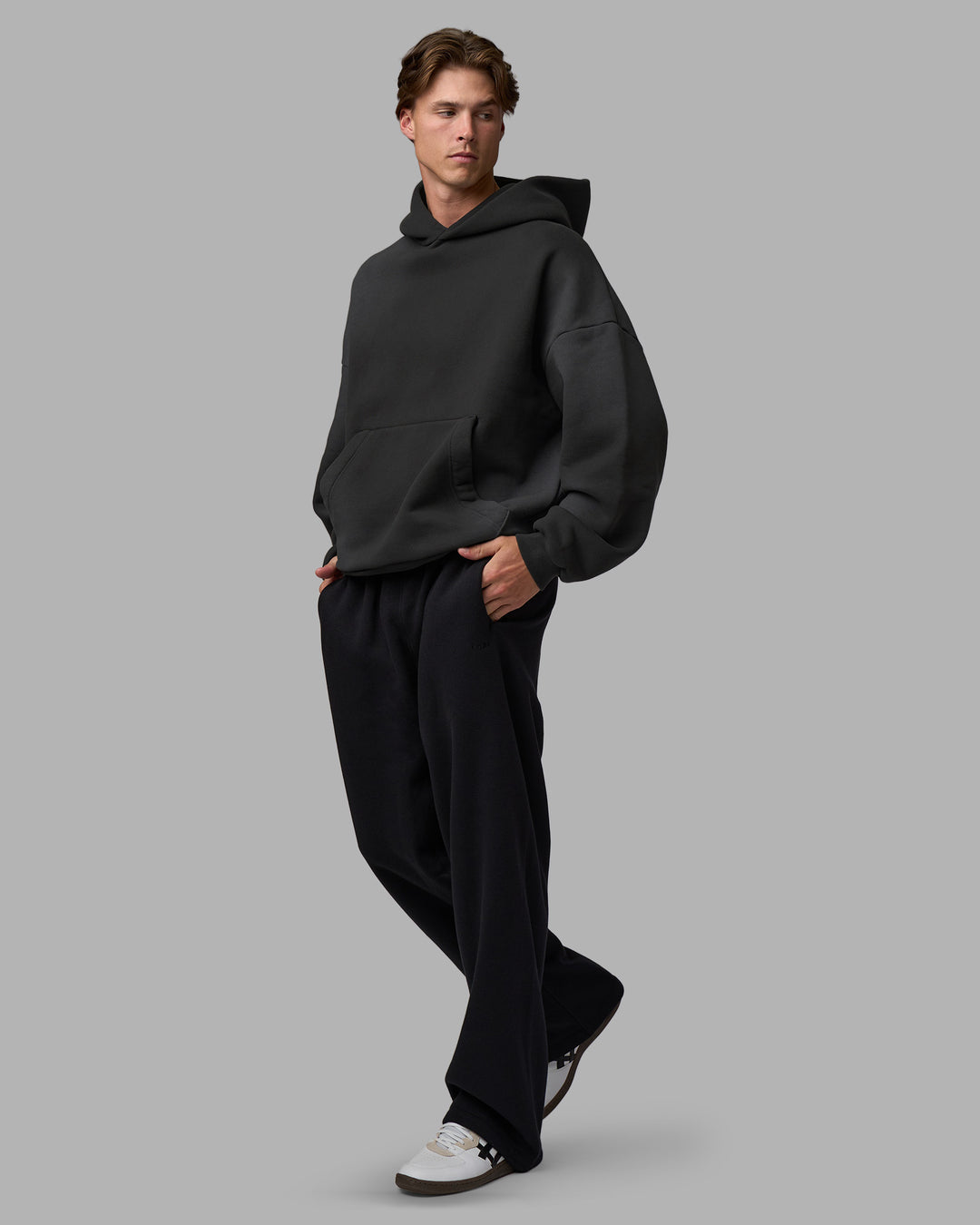 Man wearing Memory In Motion 500gsm Ultra Heavyweight Washed Hoodie - Charcoal Washed | Model:Brandon | Size:L