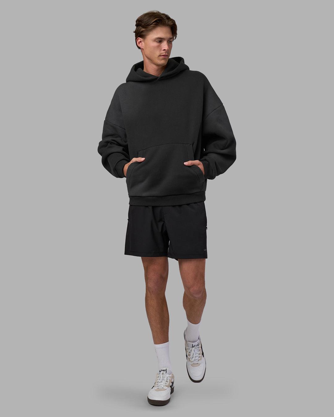 Man wearing Memory In Motion 500gsm Ultra Heavyweight Washed Hoodie - Charcoal Washed | Model:Brandon | Size:L