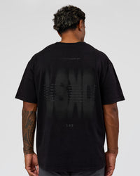 Man wearing Memory in Motion Heavyweight Oversized Tee - Black Washed | Model:Xav | Size:L