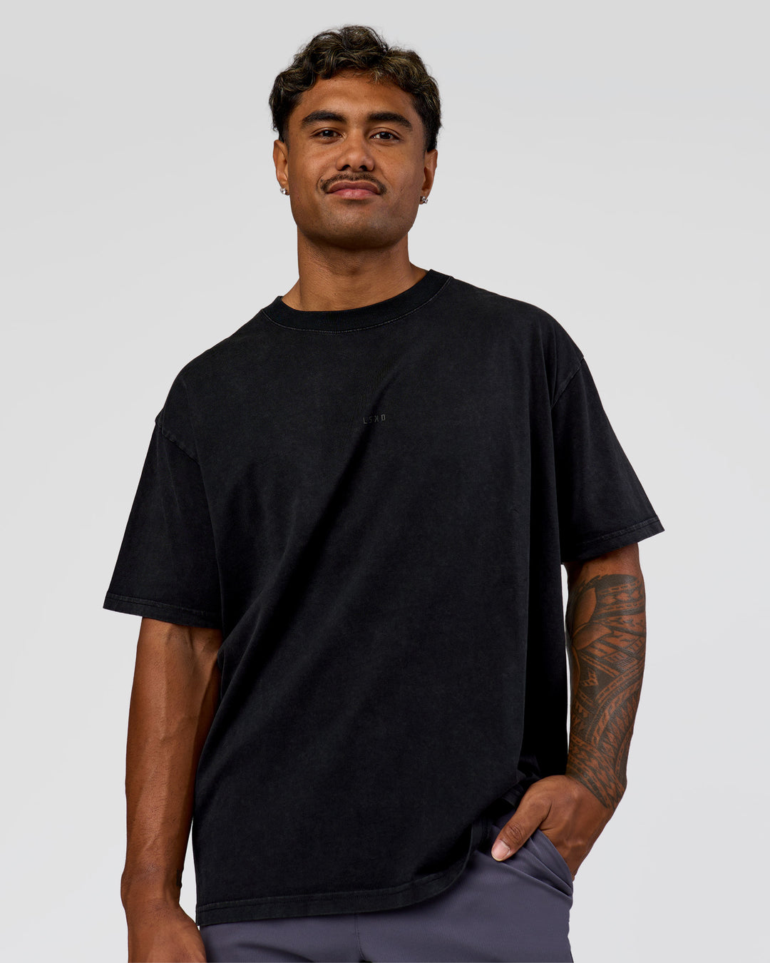 Man wearing Memory in Motion Heavyweight Oversized Tee - Black Washed | Model:Xav | Size:L