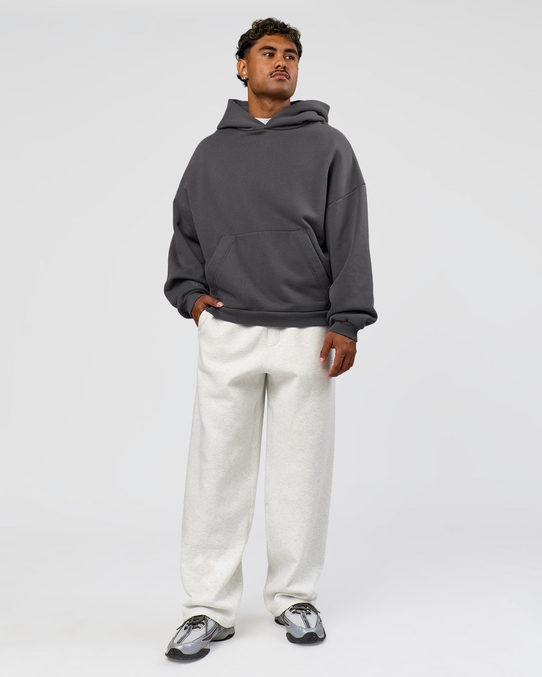 Man wearing Memory In Motion Ultra Heavyweight Washed Hoodie - Dark Storm Washed | Model:Xav | Size:L