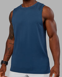 Woman wearing AeroFLX+ Seamless Muscle Tank - Indigo | Model:Sam | Size:L