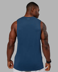 Woman wearing AeroFLX+ Seamless Muscle Tank - Indigo | Model:Sam | Size:L