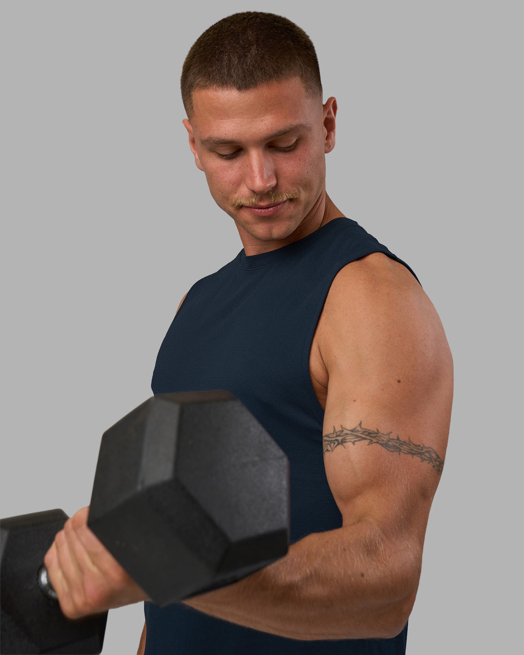 Man wearing AeroFLX+ Seamless Muscle Tank - Navy/Navy | Model:Nikola | Size:L