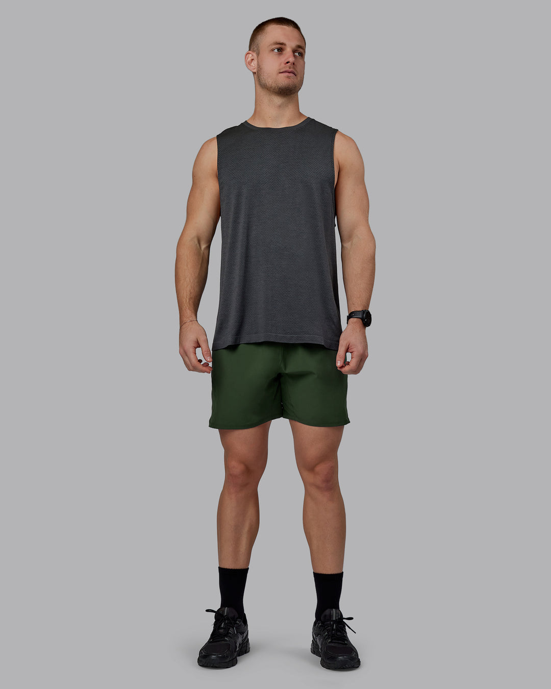 Man wearing AeroFLX+ Seamless Muscle Tank - Pirate Black Marl