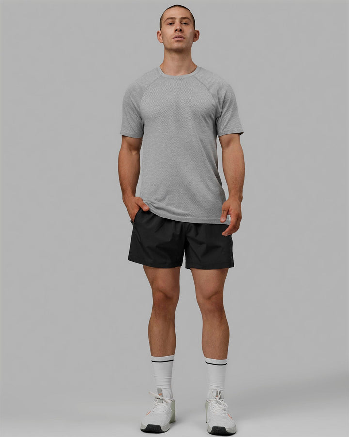Man wearing AeroFLX+ Seamless Tee - Light Grey Marl
