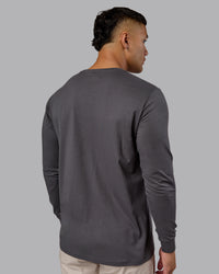 Man wearing Base FLXCotton Long Sleeve Tee - Dark Storm | Model:Kaelyb | Size:L