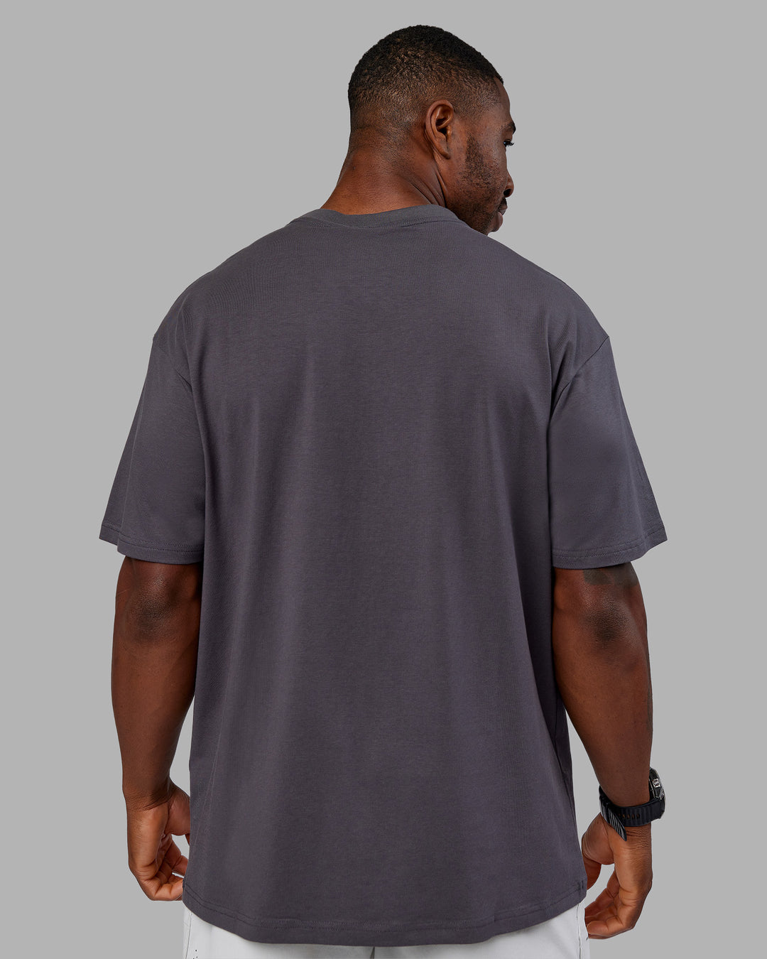 Man wearing Base FLXCotton Tee Oversized - Dark Storm | Model:Sam | Size:L