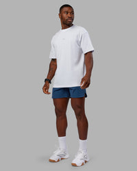 Man wearing Base FLXCotton Tee Oversized - White | Model:Sam | Size:L