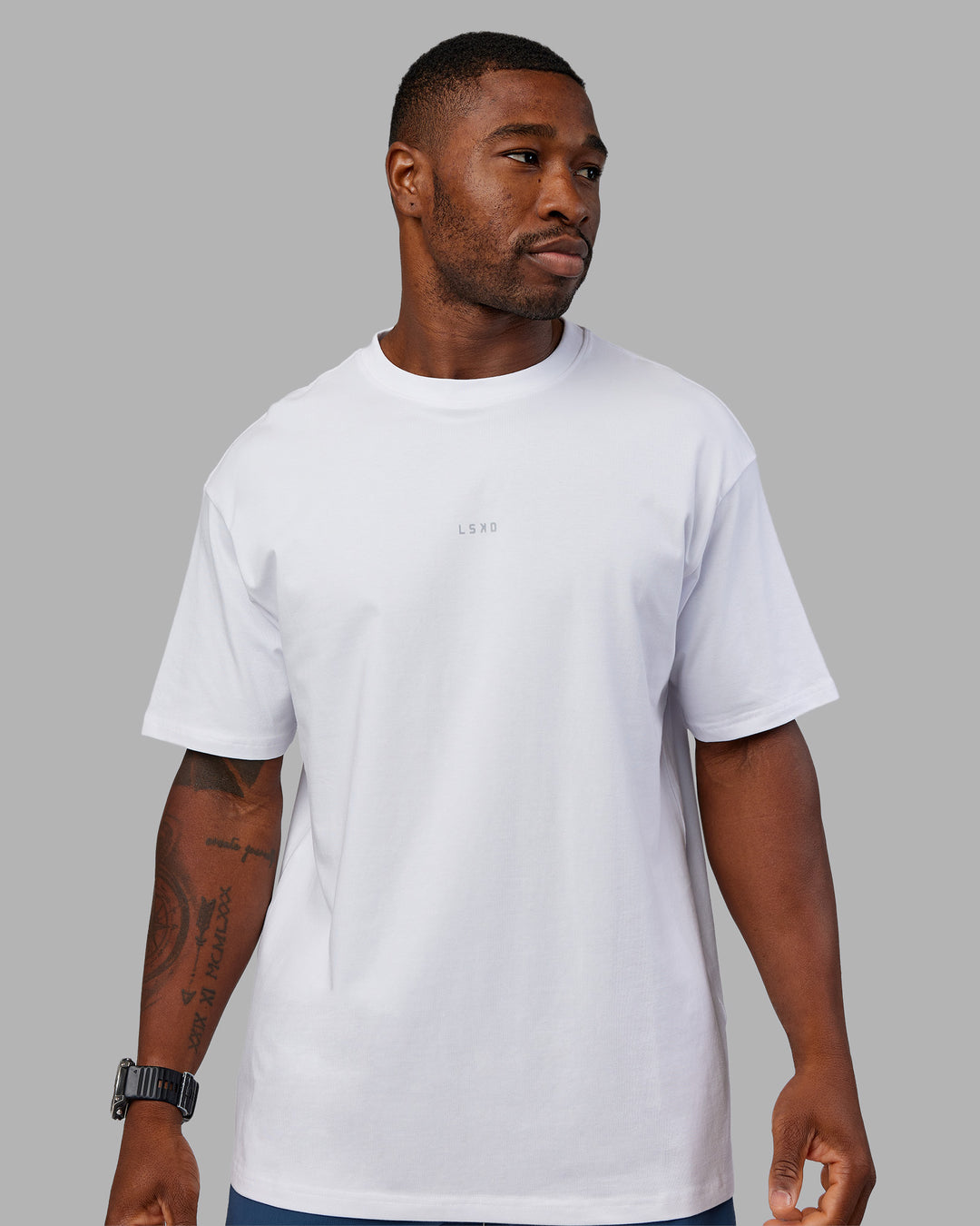 Man wearing Base FLXCotton Tee Oversized - White | Model:Sam | Size:L