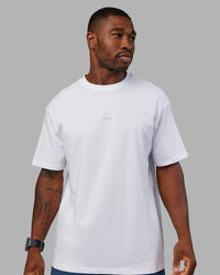 Man wearing Base FLXCotton Tee Oversized - White | Model:Sam | Size:L