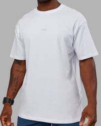 Man wearing Base FLXCotton Tee Oversized - White | Model:Sam | Size:L