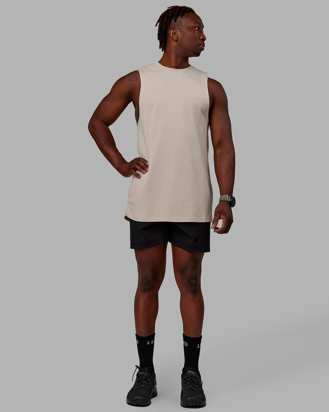 Man wearing Deluxe PimaFLX Tank - Shale Beige