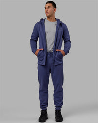Man wearing Athlete ForgedFleece Zip Track Pants - Future Dusk