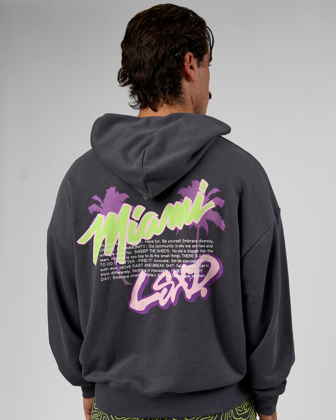 Man wearing Miami Vibe Oversized Hoodie - Dark Storm-Marshmallow | Model:Adam | Size:L