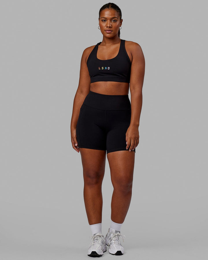 Woman wearing Rep Mid Short Tight - Pride-Black