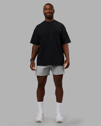 Man wearing Move Fast Washed Heavyweight Tee Oversize - Black-Island Paradise | Model:Sam | Size:L