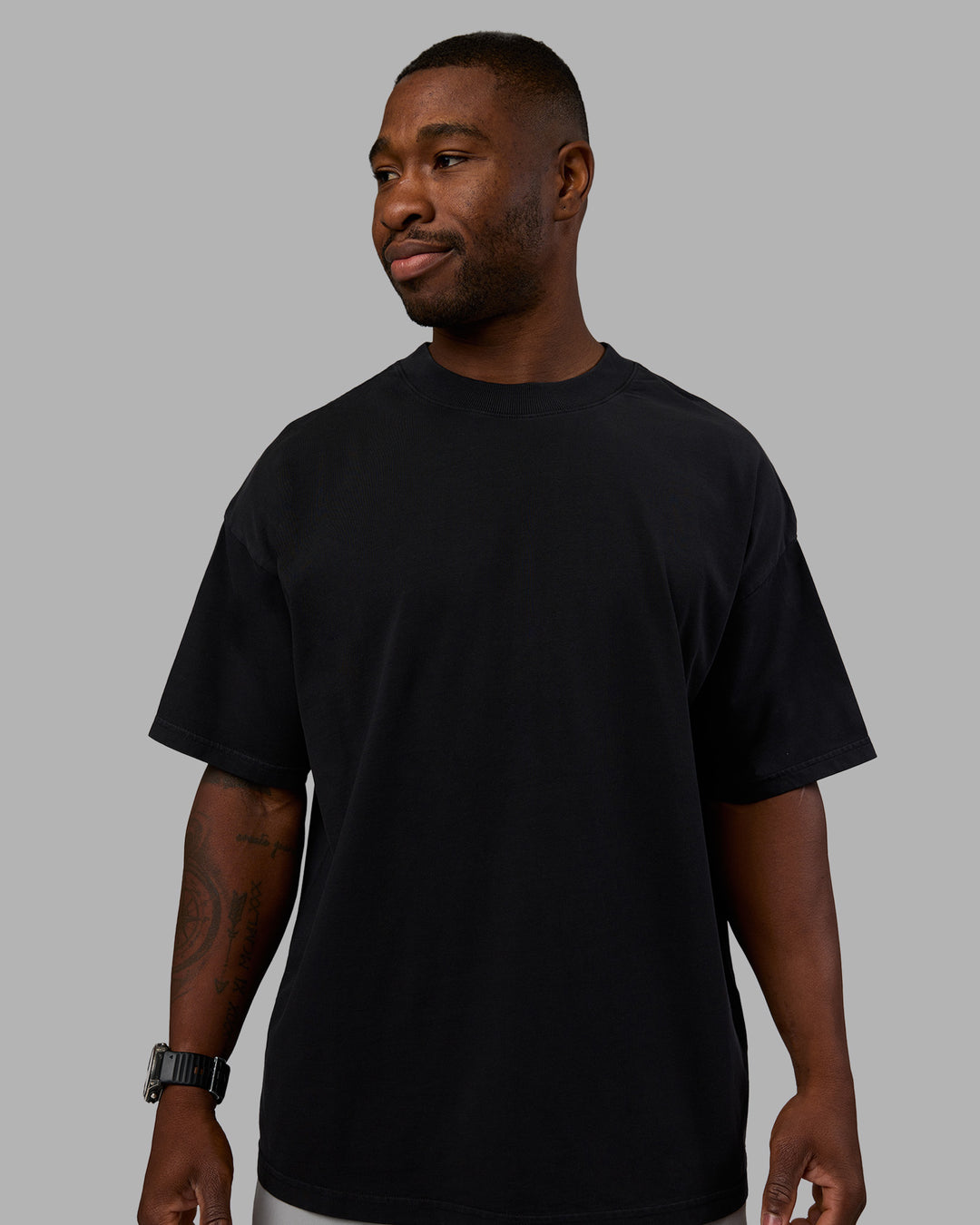 Man wearing Move Fast Washed Heavyweight Tee Oversize - Black-Island Paradise | Model:Sam | Size:L