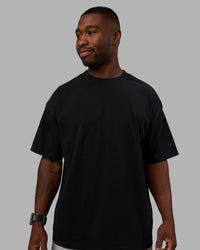 Man wearing Move Fast Washed Heavyweight Tee Oversize - Black-Island Paradise | Model:Sam | Size:L