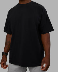 Man wearing Move Fast Washed Heavyweight Tee Oversize - Black-Island Paradise | Model:Sam | Size:L