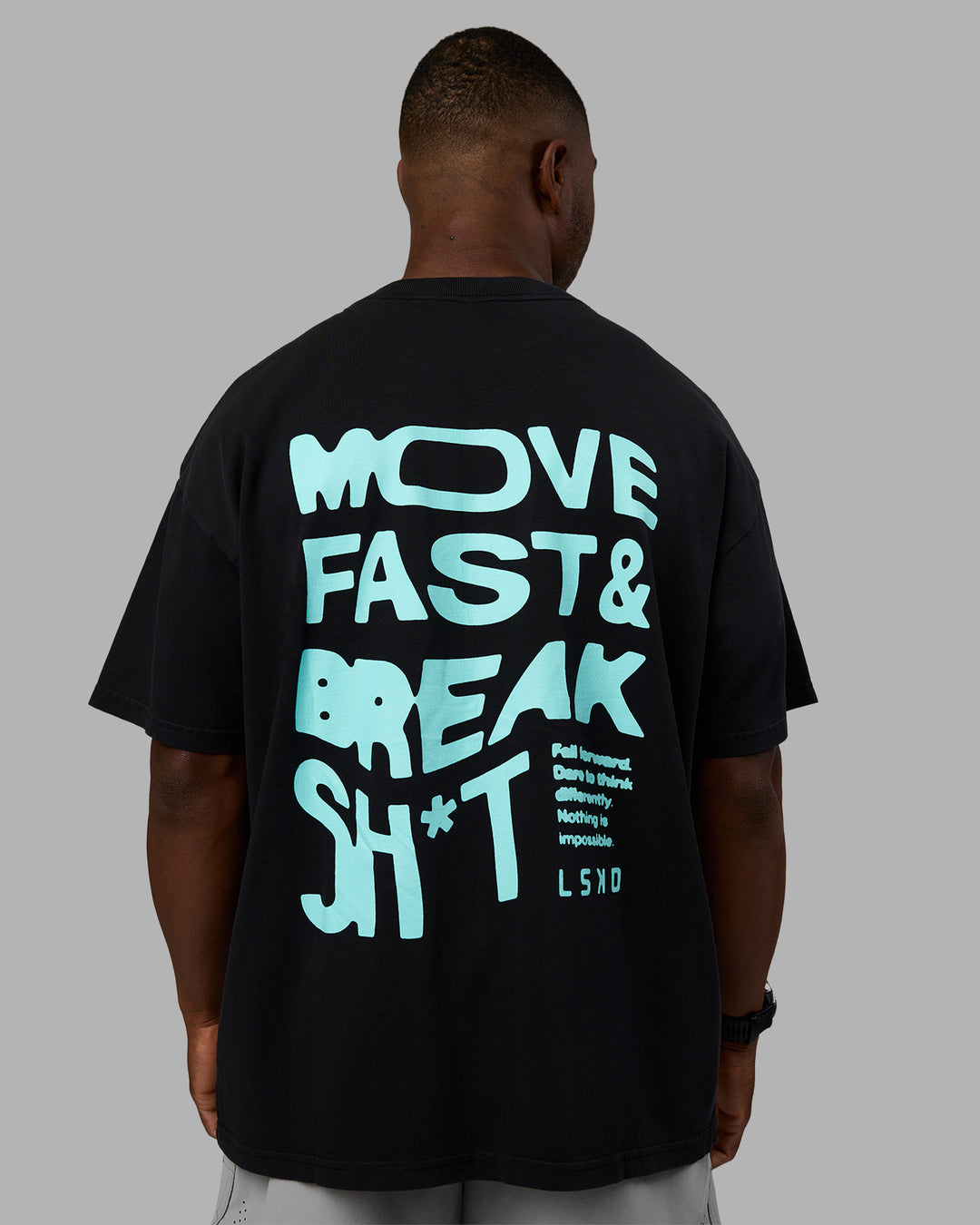 Man wearing Move Fast Washed Heavyweight Tee Oversize - Black-Island Paradise | Model:Sam | Size:L