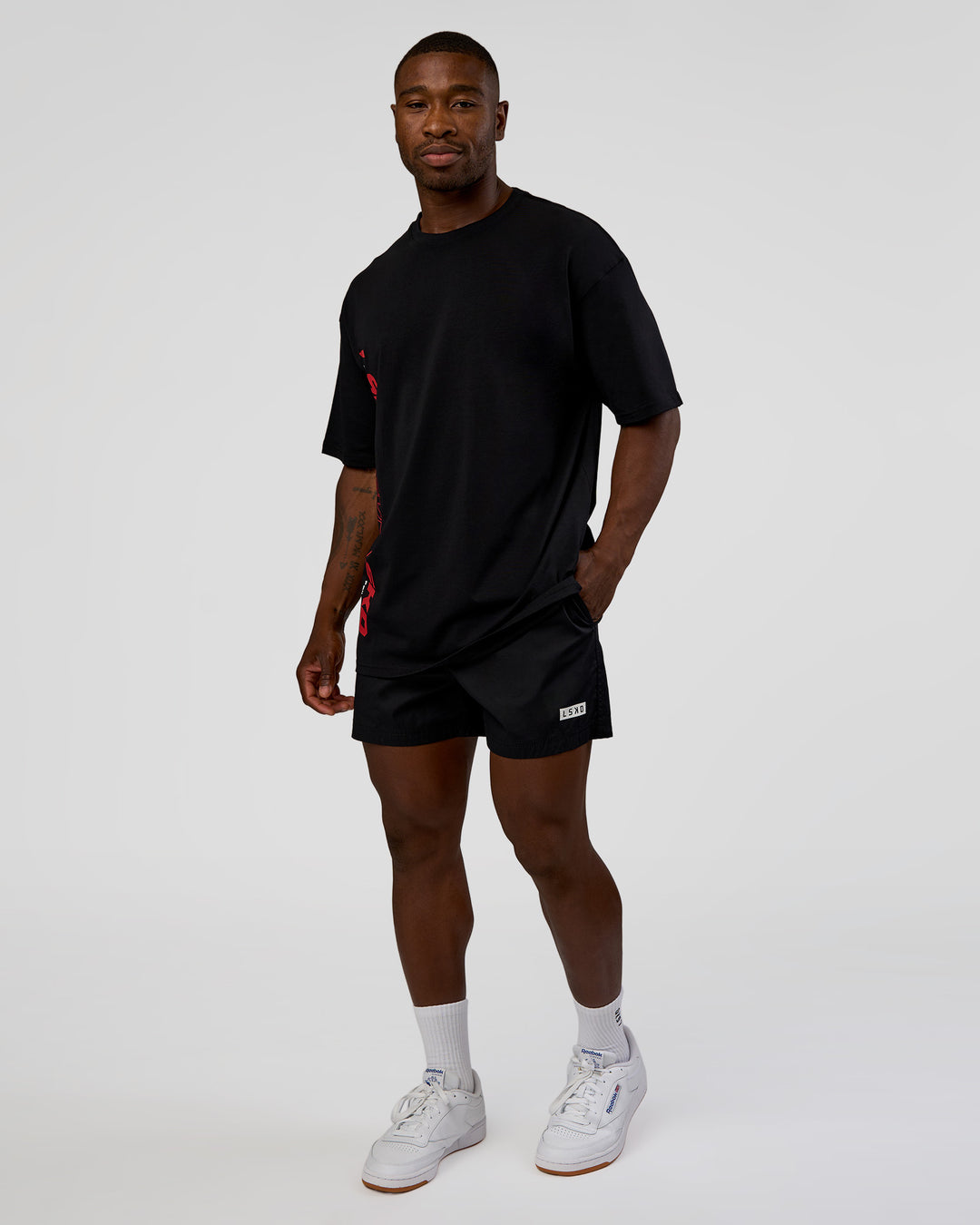 Man wearing Nothing Is Impossible FLXCotton Oversized Tee - Black-Flame | Model:Sam | Size:L