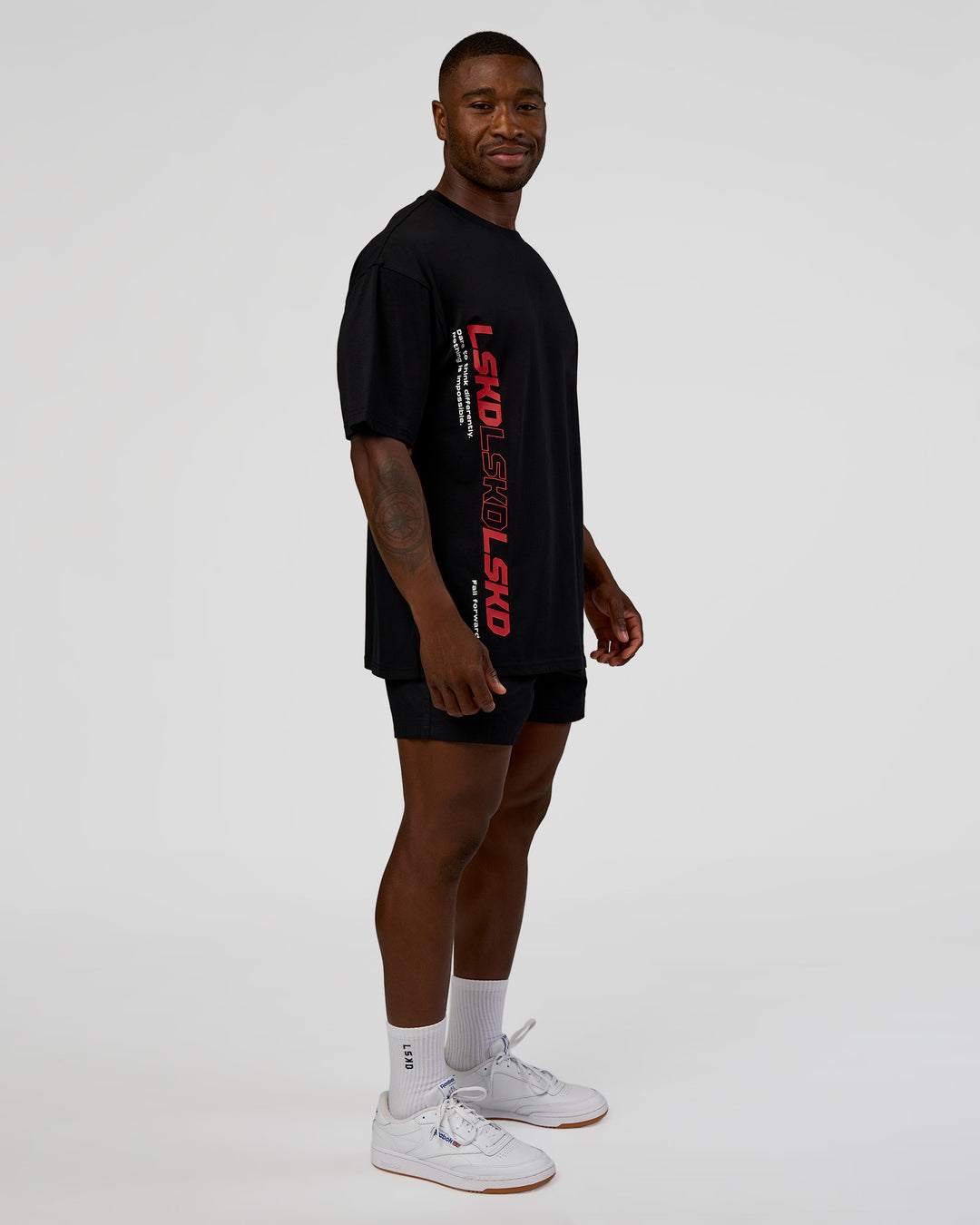 Man wearing Nothing Is Impossible FLXCotton Oversized Tee - Black-Flame | Model:Sam | Size:L