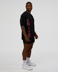 Man wearing Nothing Is Impossible FLXCotton Oversized Tee - Black-Flame | Model:Sam | Size:L