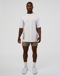 Man wearing Nothing Is Impossible FLXCotton Oversized Tee - White-Vital Green | Model:Sam | Size:L
