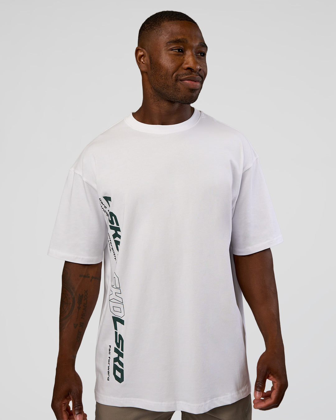 Man wearing Nothing Is Impossible FLXCotton Oversized Tee - White-Vital Green | Model:Sam | Size:L