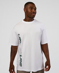 Man wearing Nothing Is Impossible FLXCotton Oversized Tee - White-Vital Green | Model:Sam | Size:L