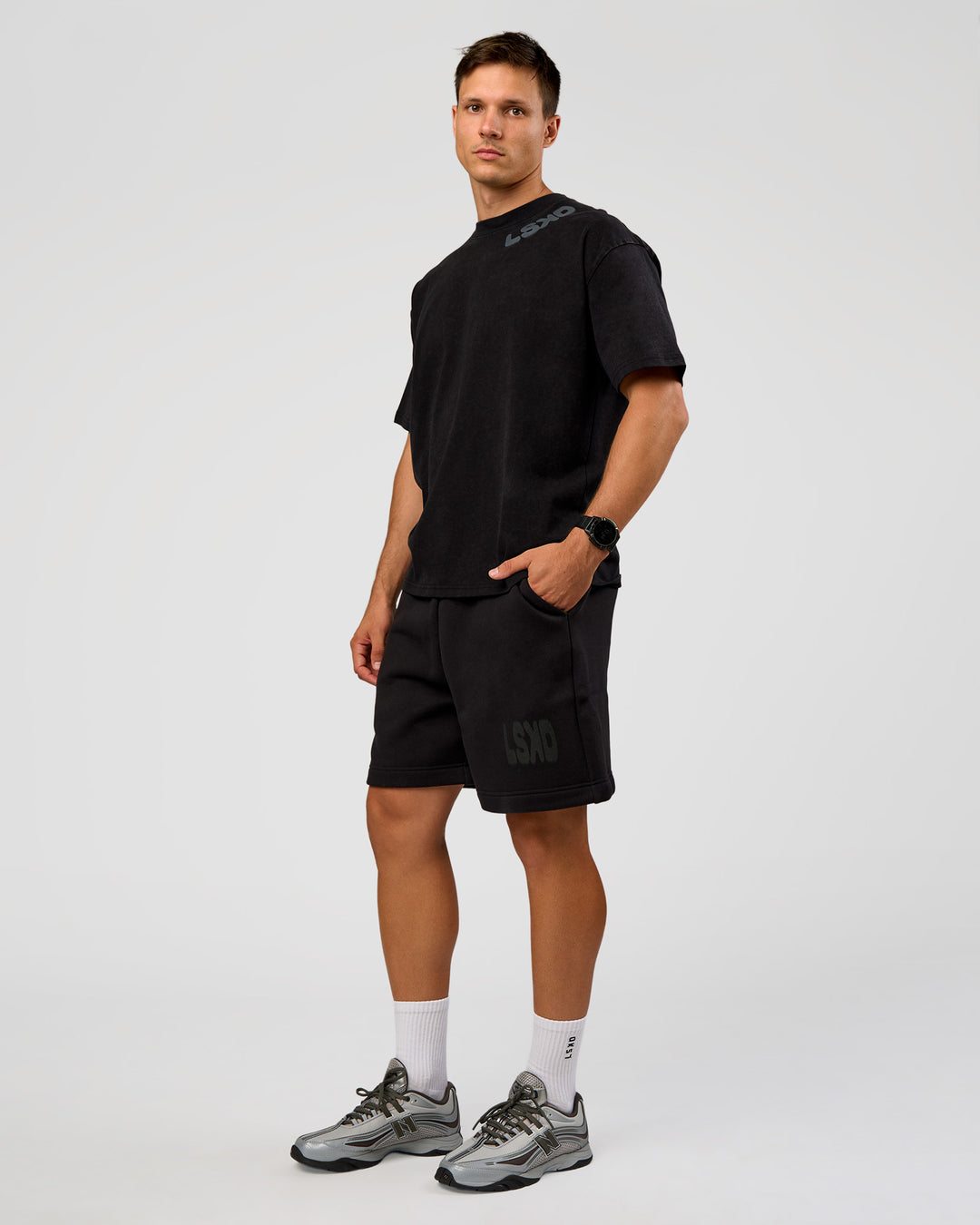 Man wearing Offset Heavyweight Unisex Oversized Tee - Black Washed-Castlerock | Model:Liam | Size:L